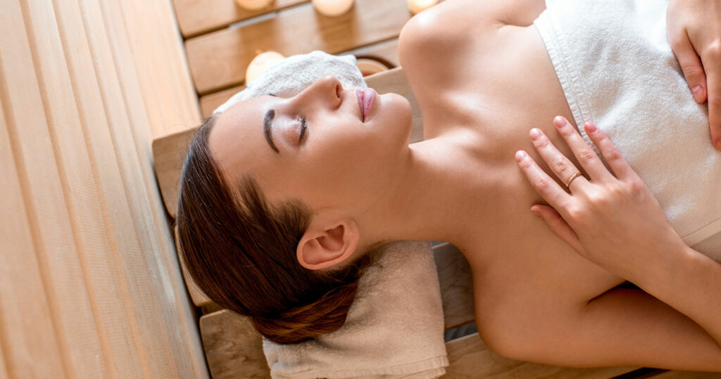 Infrared Sauna Guide: Boost Your Health in Chelan, WA - Swim World Chelan Blog a woman relaxing in an infrared sauna